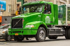 A Man Riding Green Truck