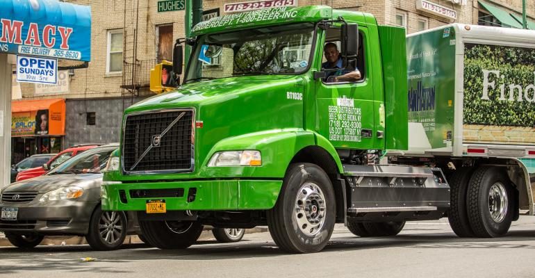 A Man Riding Green Truck